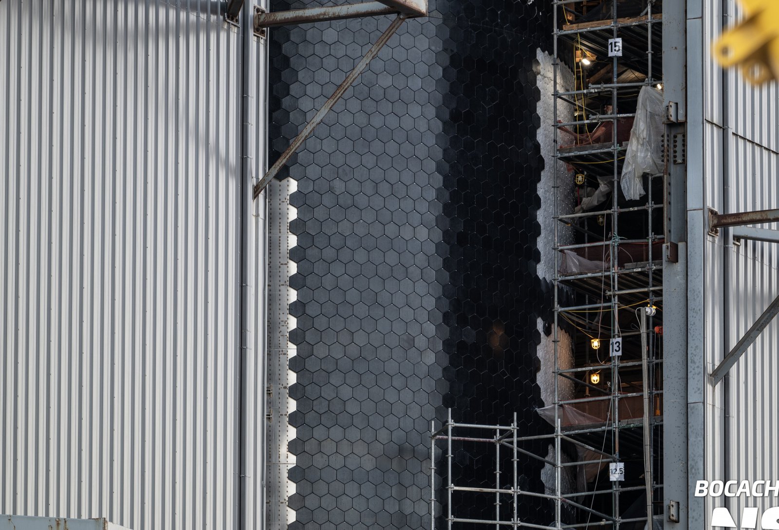 Close-up of hexagonal Starship heat-shield tiles being installed at Starbase