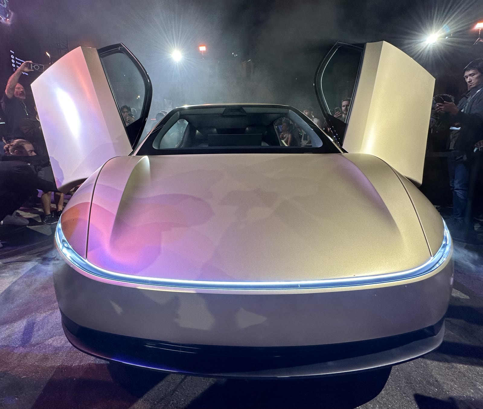 Front of a gold Tesla Cybercab at the 2024 unveil