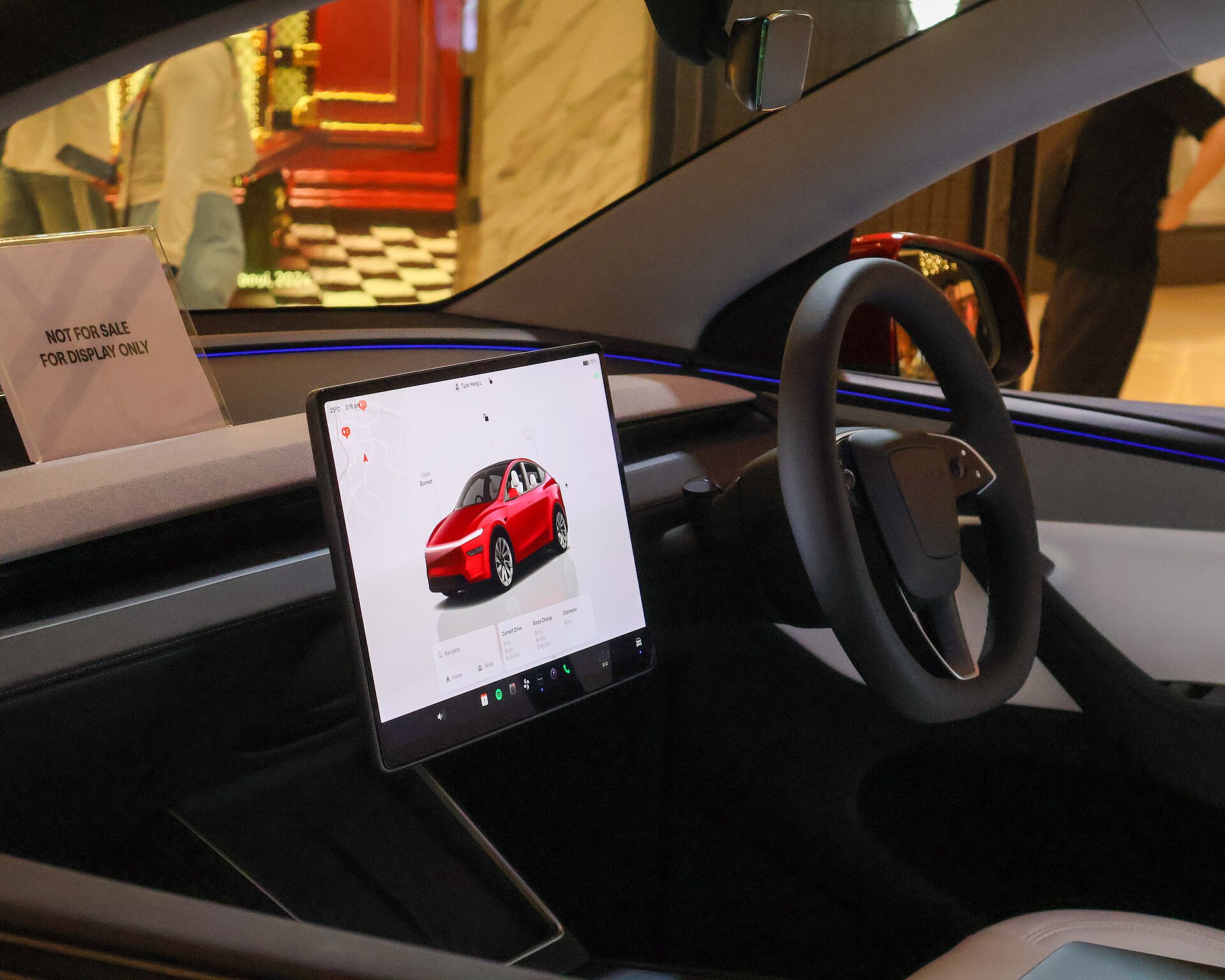 Tesla Model Y cabin touchscreen and steering wheel