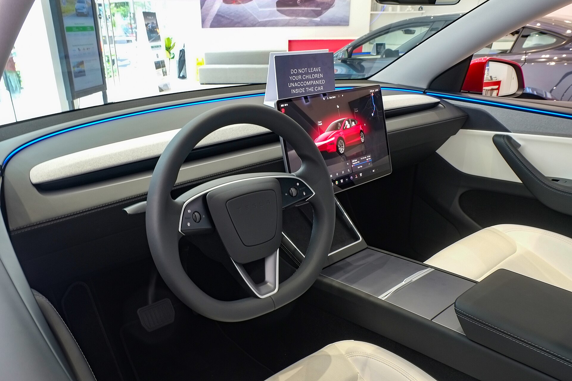Tesla Model Y Juniper cabin with white seats and central touchscreen